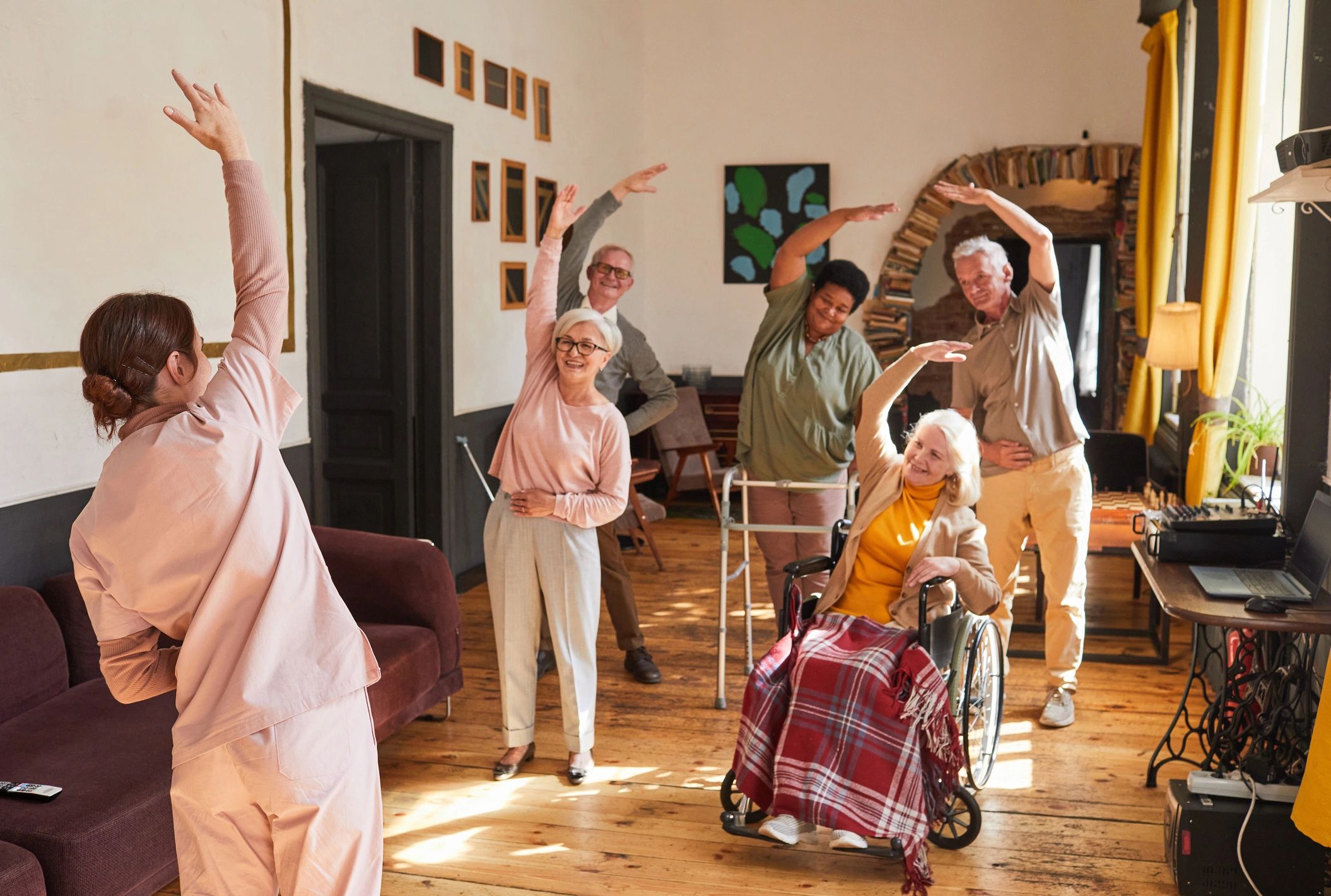 Group of seniors doing morning exercises in a retirement home