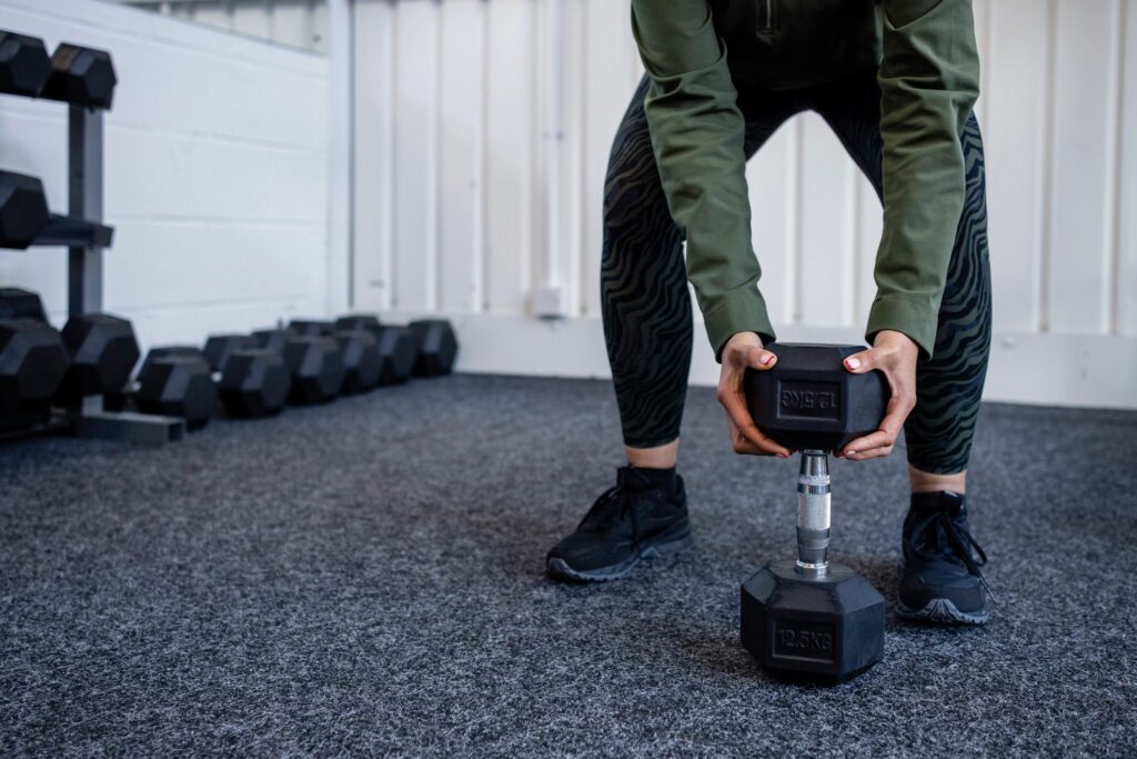 Exercising in the Gym With a Dumbbell