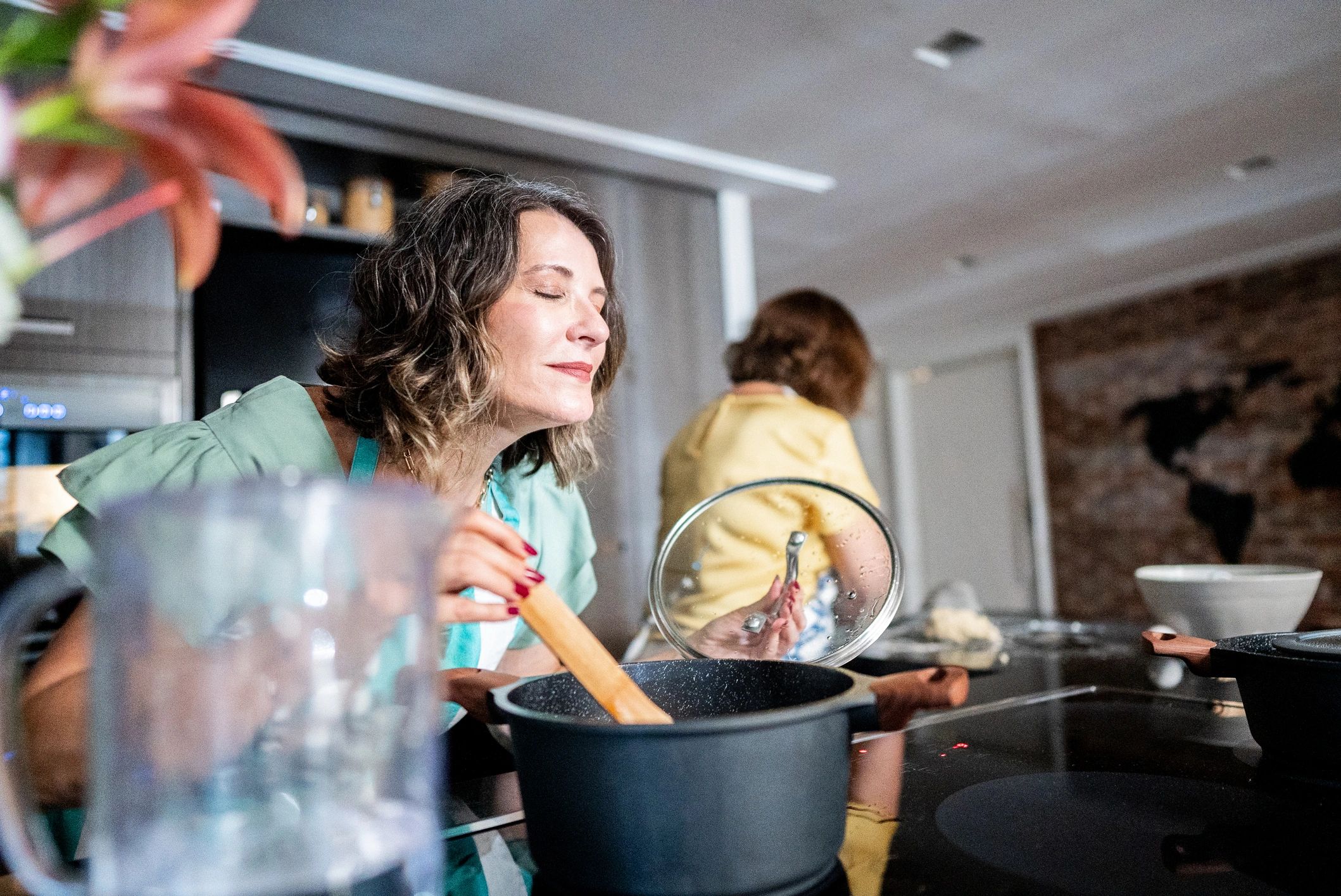 Mature woman cooking at home for recovery-focused meals